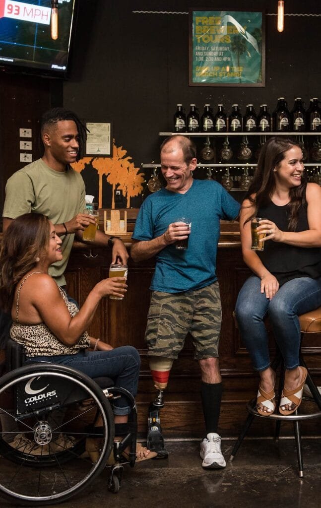people on the bar drinking and conversing